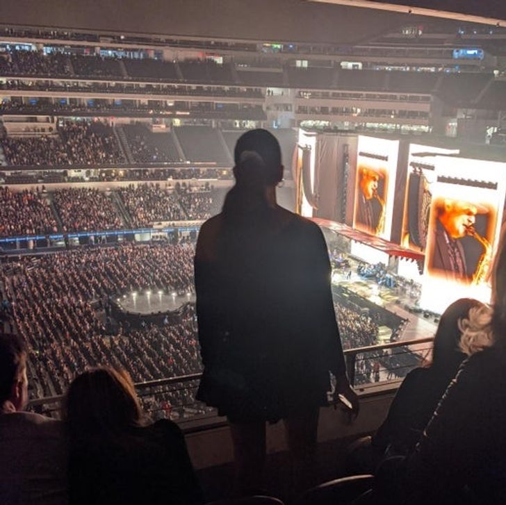 Stood during the entire concert, nobody else was standing. Picked a fight with someone who asked her to sit down.