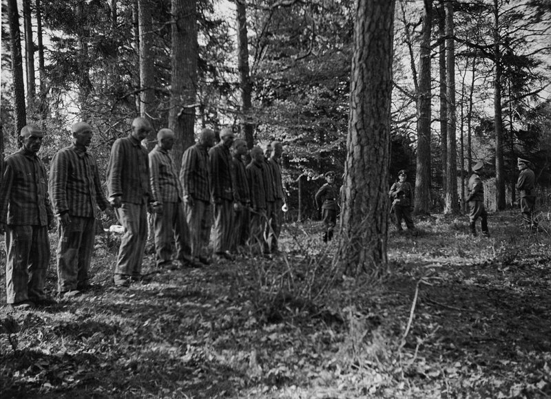 20 Polish prisoners from Buchenwald awaiting execution by hanging in the forest near the camp in 1942 in retaliation for the death of a German overseer. Hundreds of forced laborers from the surrounding area were rounded up and forced to watch the executions
