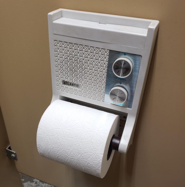 “The bathroom I’m using has toilet paper holders with built-in radios in each stall.”