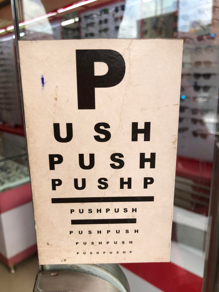 “The push/pull sign on the door of a glasses shop”
