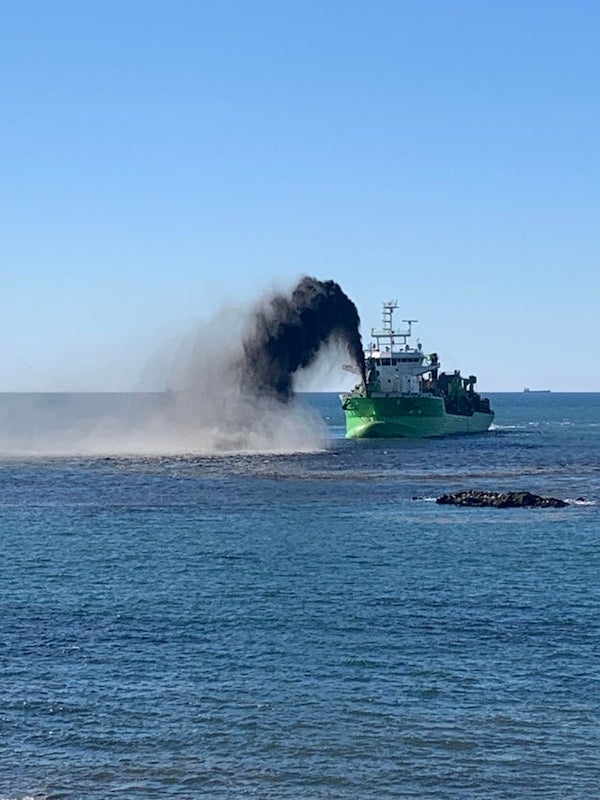 What is this ship/vessel spewing off the coast of Portugal?

A: It’s dredging. Either to clean the seafloor, or to make new land where it’s dumping the sand.