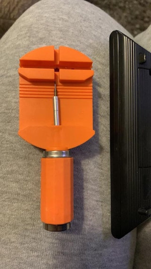 This tool was in a pallet of miscellaneous stuff. There are no markings or numbers on it. It is made of plastic and metal. The metal part screws into the handle. I have no idea what it could be.

A: It’s a watch band pin remover.