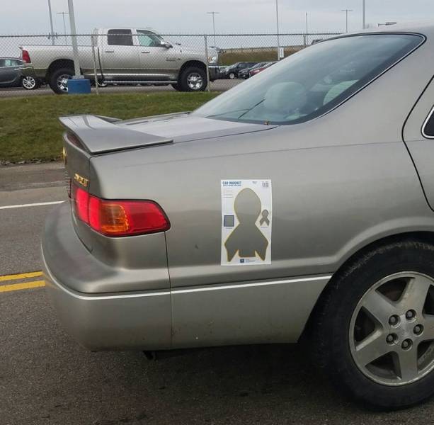 “This car is using the wrong part of the cancer ribbon magnet.”