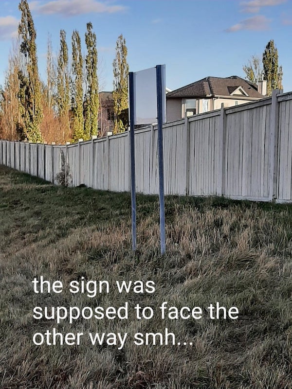 fence - the sign was supposed to face the other way smh...