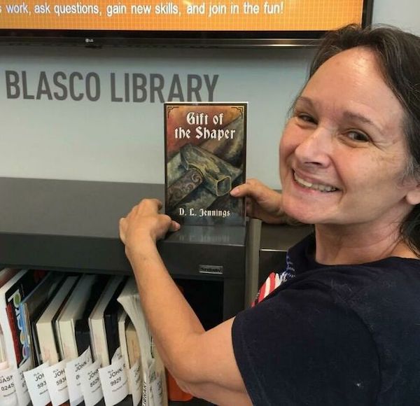 My mom found my book in her local library and I can’t get over how proud she looks.