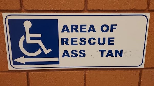 funny vandalism - street sign - Area Of Rescue Ass Tan