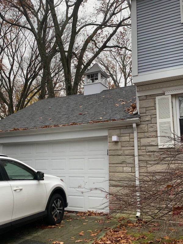 On top of the garage. About the size of a chimney but with windows on all 4 sides.

A: It’s a cupola. Originally they were used for adding light to the rooms under them.