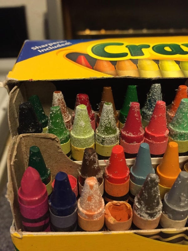 What is this residue that looks like glitter snow on these washable crayola crayons? They have been in a bag in a cupboard for 5 years and the residue is only on the wax of the crayons.

A: It is wax bloom, which is just the wax in the crayons oxidizing over time.