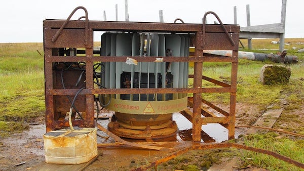 Found this in Russia whilst driving around in google maps, made out of rusted iron, seems to be picable with a crane, seems mildly radioactive. thanks.

A: It’s the Beta-M, a radioisotope thermoelectric generator.