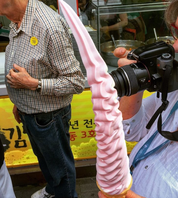 “This is how you soft serve. More than a foot of strawberry/vanilla swirl seen in Myeong-Dong, Seoul, South Korea.”