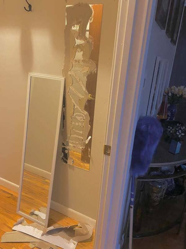 Removing a cheap mirror glued to the wall, only to find an even cheaper mirror glued to the wall beneath it.