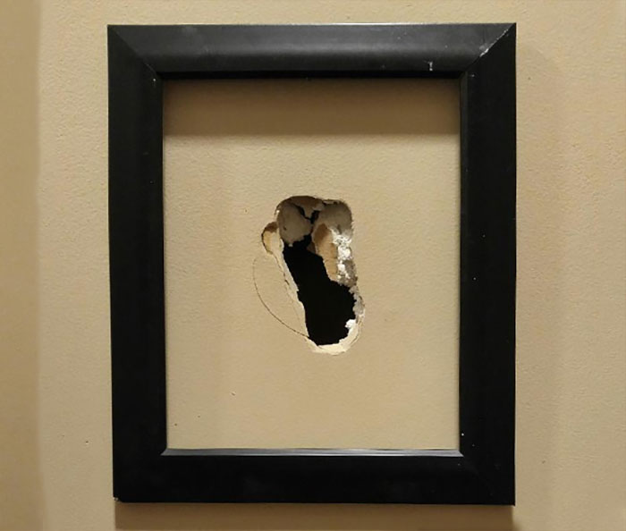 A framed hole in the wall. My friend had a mental breakdown once and punched a hole in their living room wall. Their mother framed it.