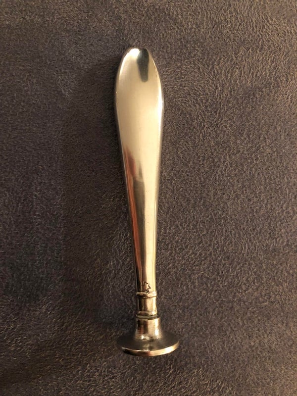 What is this metal item? Unsure exactly what material, unsure of age, unsure of origin but found here in the netherlands. Has a small star shaped inscription and no other markings. Bottom is very scratched up.

A: Pipe tamper— 100%. You have to tamp your tobacco while smoking.