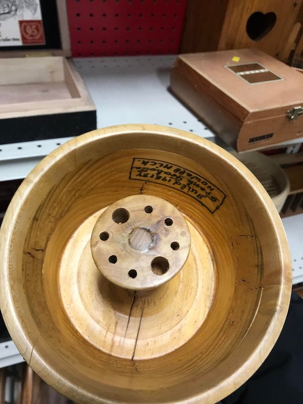 Handmade wood bowl, what is it meant to hold?

A: It’s a nutcracker and pick for nuts