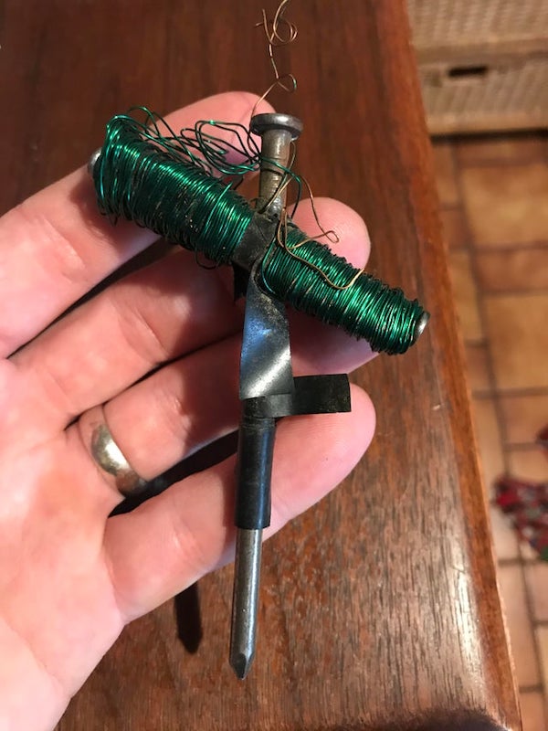 Left in our attic by previous home owner. Made of green wire, 5 nails, electrical tape.

A: It’s a homemade electromagnent