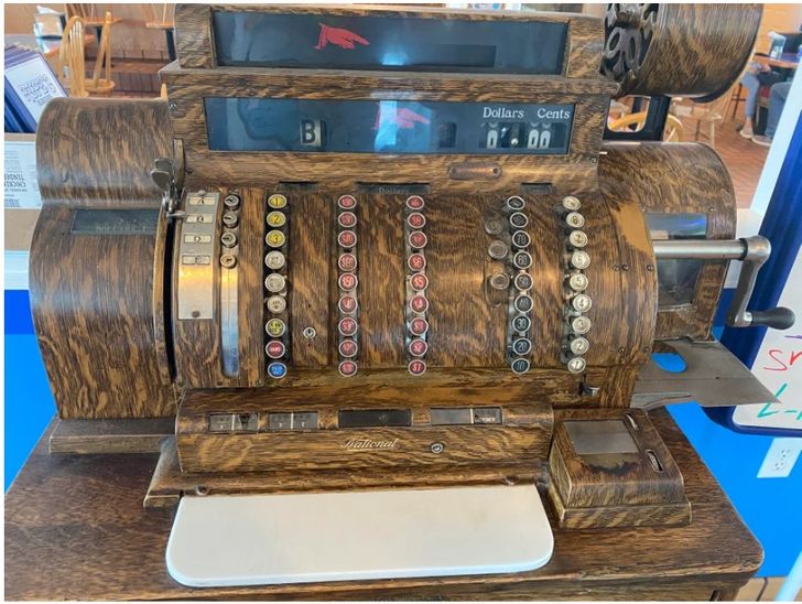 Looks like a lot of modern-day folks would need strong muscles to operate this retro heavy-duty cash register.