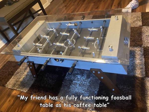 table - "My friend has a fully functioning foosball table as his coffee table"