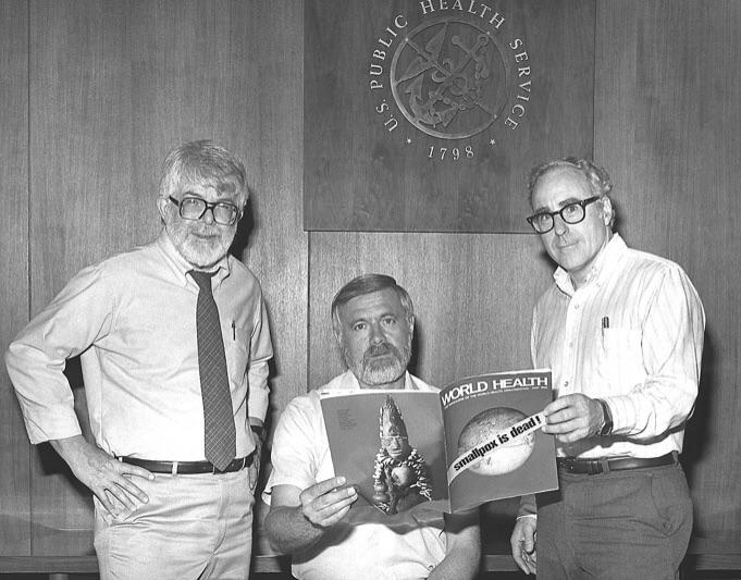 Three former directors of the Global Smallpox Eradication Program read the news that Smallpox had been globally eradicated, 1980