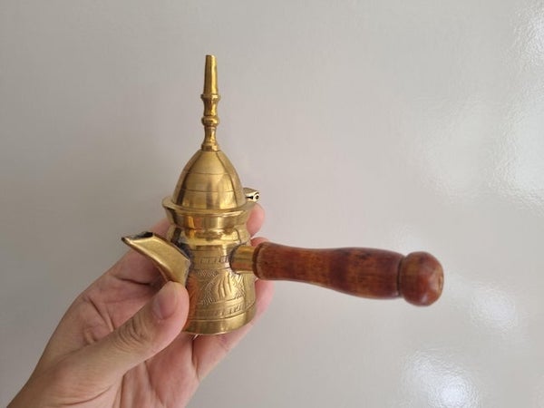 What on Earth is this thing? Seems like it’s intended to serve something. Thought of a Turkish coffee thingy but it’s too small.

A: It is a single serve Turkish cofee “finjan.”