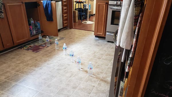 My son told my husband there was a lot of water coming from under the sink to the fridge