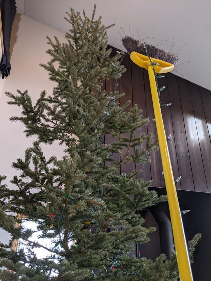 Brooms work quite well when putting lights up on tall trees!