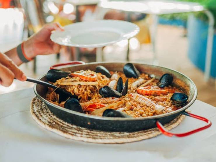 "In Spain, walk away from any restaurants that serve paella for dinner. We only eat paella at lunch, folks, and that is a sign of a tourist trap. And if there are photos of the food out front, that's a bad sign."