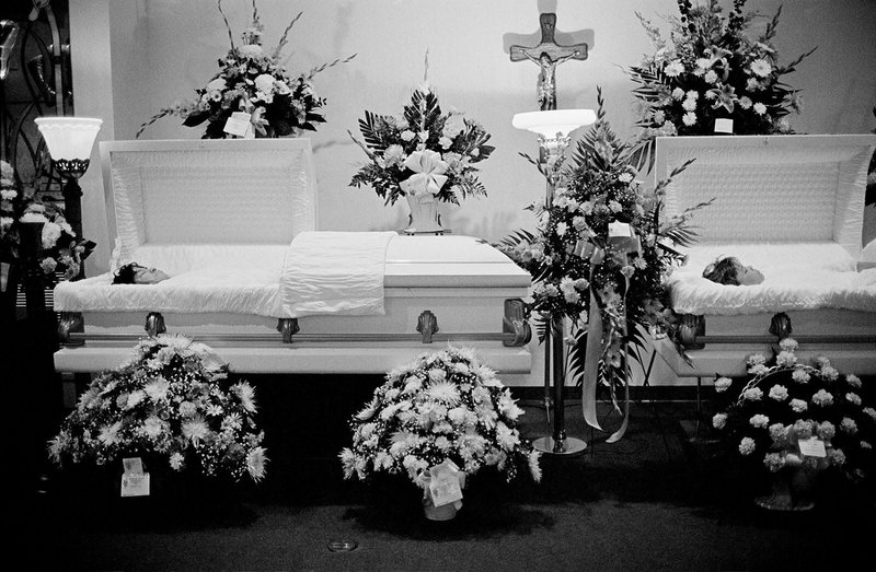 Open caskets of Diane Hawkins and her 13-year-old daughter Katrina Harris, who were found fatally stabbed and mutilated. Hawkins had been disemboweled, her heart cut out. Harris had been partially decapitated. Hawkins’s ex-boyfriend, Norman Harrell, was found guilty on all counts for their murders