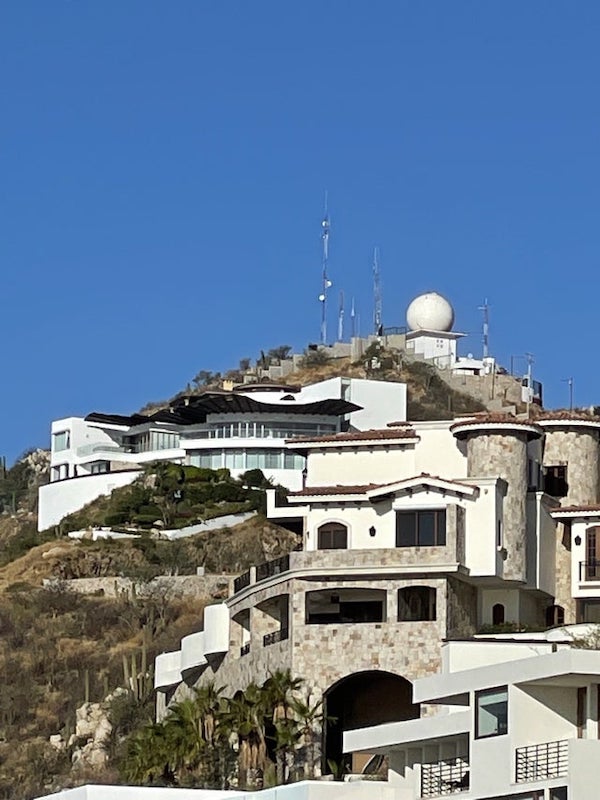 What is this white globe on top a building?

A: Appears to be a radome for some sort of radar system.