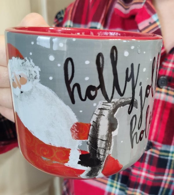 My fiancée has this mug and we can’t figure out what Santa is supposed to be holding? (it just says “holly jolly holidays”)

A: It’s a list like a scroll, a naughty and nice list I’d imagine.
