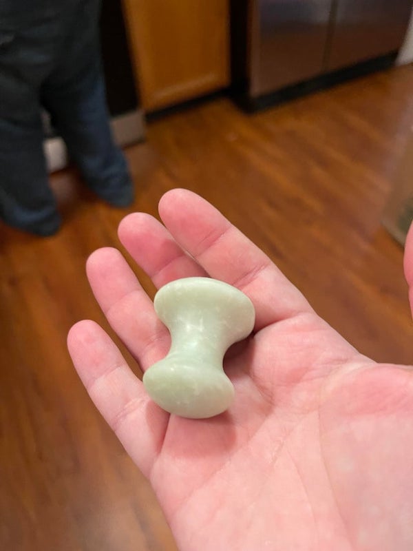My husband found this in our new houses ice maker? It’s jade we think.

A: Mount Lai The De-Puffing Jade Eye Massage Tool.