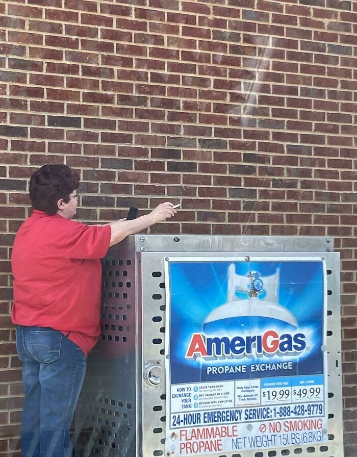 stupid people - woman smoking cigarette near propane tank - AmeriGas Propane Exchange Out How To Exchange My Came Intore Your Tank Toplote Tuk $19.99 $49.99 24Hour Emergency Service 18884289779 Flammable No Smoking Propane Net Weight 15LBS. G