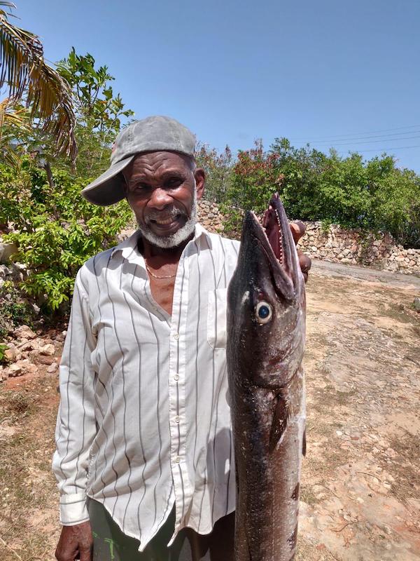 My grandpa caught a barracuda and is kinda proud.