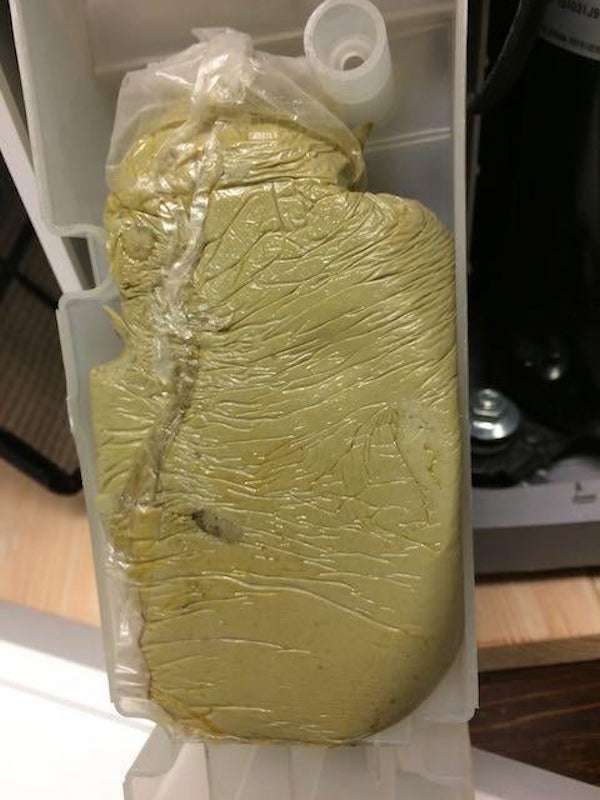 A putty type substance found inside a dehumidifier. It doesn’t seem to have any purpose that I can think of since it’s inside a plastic bag which is inside a plastic box with no visible pipes or vents attached to it. It doesn’t have any smell but it’s oily like glazing putty.

A: It’s foam. Possibly for sound deadening so the compressor isn’t as noticeable. Bagged expanding foam is common for applications where you want to fill a space but don’t want the foam to make contact with what’s in the space. It’s more commonly used in packaging of odd shaped items, but can be used in other applications seen here.