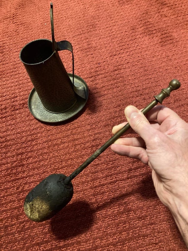 Found this with other fireplace tools in a house I bought. Smells vaguely of asphalt. What is it?

A: A Cape cod firestarter