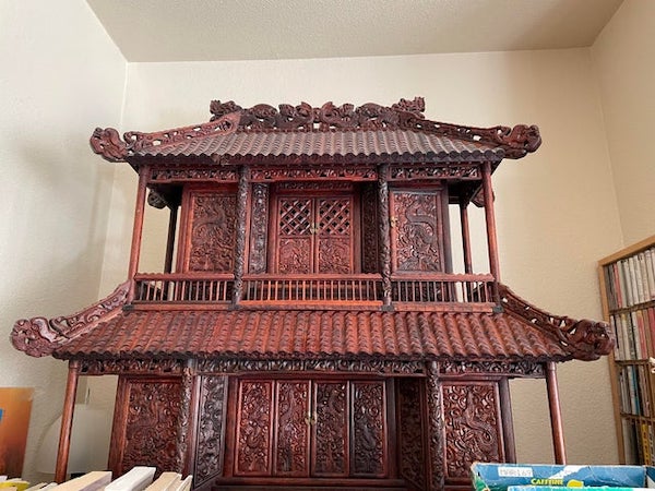 Wooden house with lots of drawers

A: It’s a kamidana, a home shinto shrine. Very valuable and a bit religiously touchy to be having, selling or whatever. The spirits of a families loved ones inhabit it.