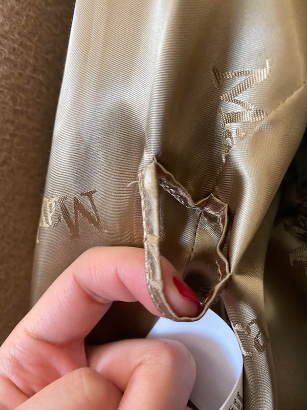 What is this loop inside my coat, next to where the sleeve is?

A: It’s for the belt.