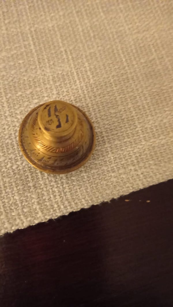 This little brass thing was in my family for generations. Its around 5 cm big. It is probably made from brass. All of the old folks passed away and no one knows anymore what it is. My family is polish.

A: It’s an elephant claw bell. The story was that as long as you ring the bell, there would be no elephants around. It worked, too. Or ten year old me believed it did. I don’t know when or why she got it.