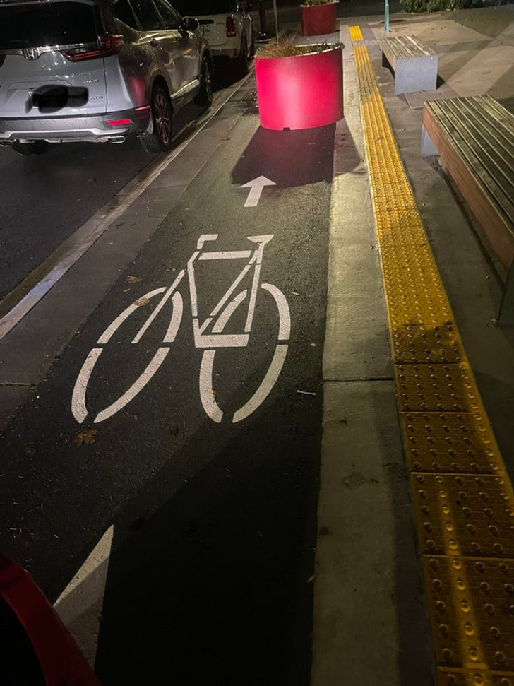 “This bike lane with large planters right in the middle, leaving almost no room for cyclists.”