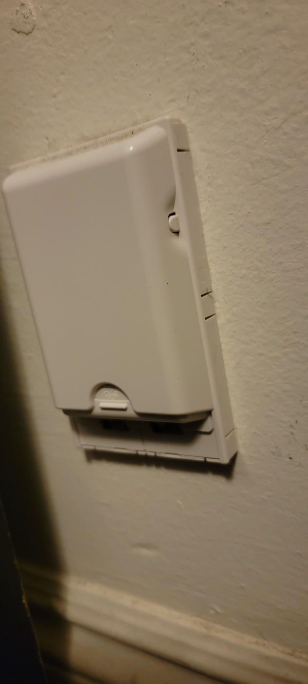 What is this thing on our apartment wall with an explosion image, and should I not be messing with it?

A: I believe it is a older style laser beam for house alarms.