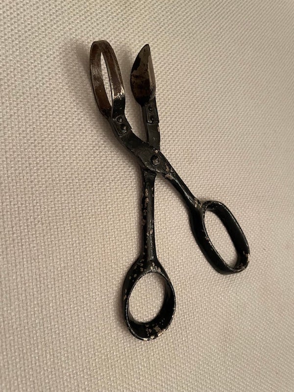 Scissors that don’t cut? One side is a spoon and the other side is a loop that just fits around the spoon. It’s about six inches long. Found in an old junk drawer.

A: Those are pineapple eye scissors. They are for removing the tough spots on a pineapple after you skin it.