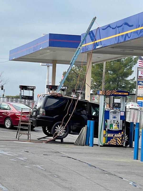 Just a little boost to reach this gas station roof.