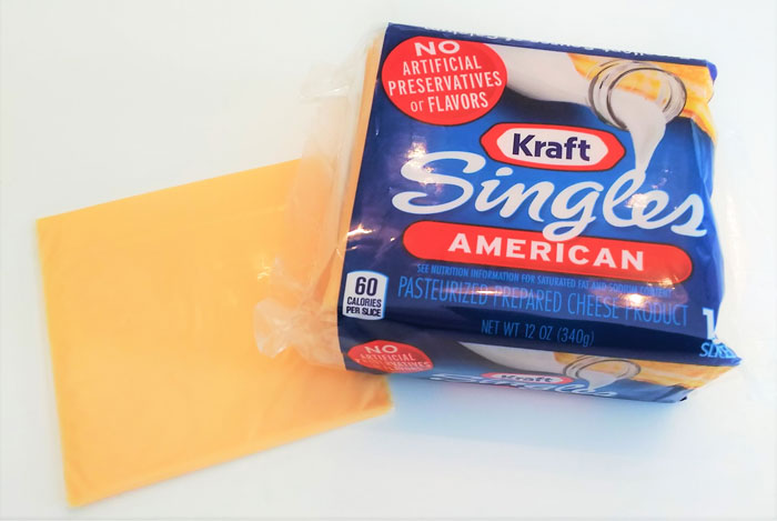Kraft American cheese slices. You could hold me up at cheese point and I’d give you everything I’ve got, I can’t even stand to look at the stuff.