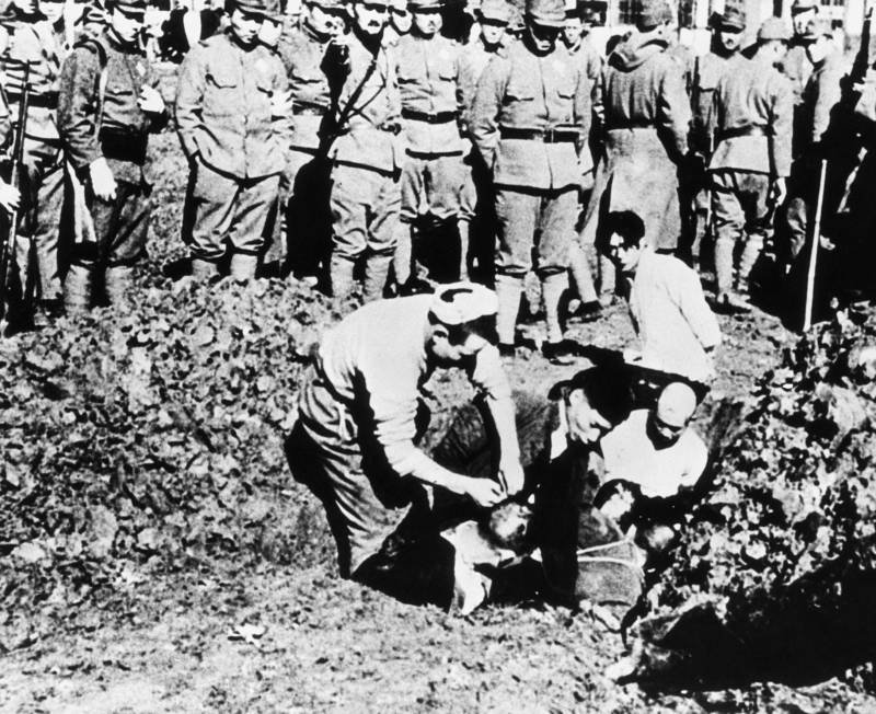 Photo of Chinese civilians shortly before being buried alive by Japanese soldiers during the Rape of Nanjing
