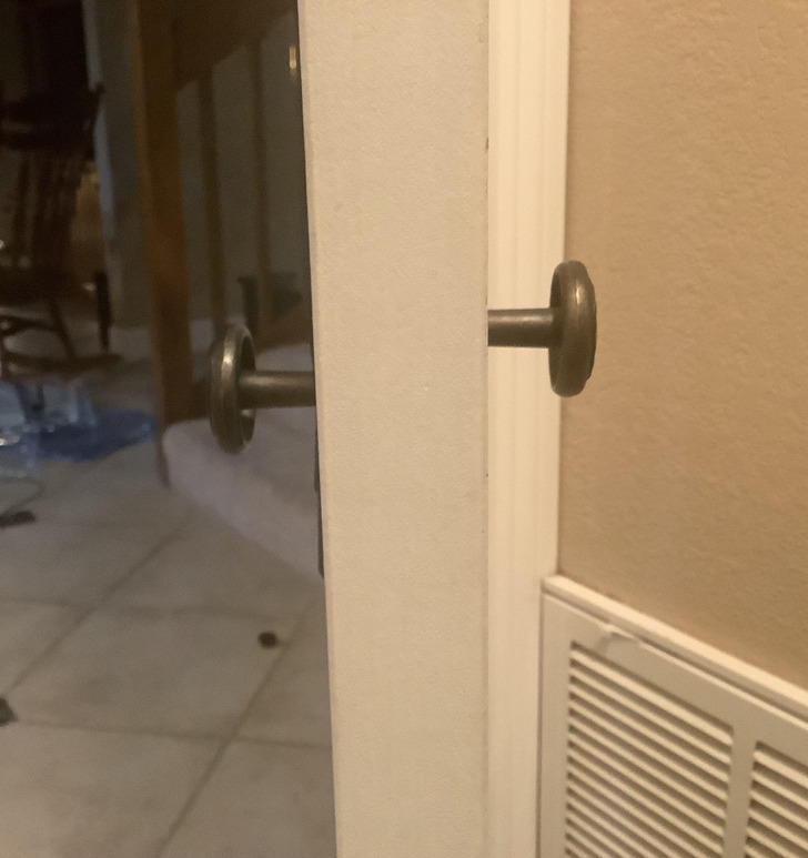 randoms things amused and surprised - door with off centered knobs