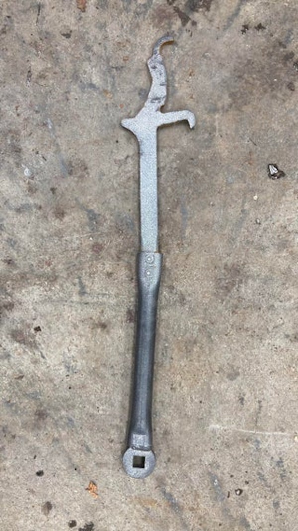 Found on the side of a road. 2 feet long. Bout 3/8 inch thick on the hook side. Painted.

A: It’s a tool for hooking up weight distribution bars on a trailer hitch.