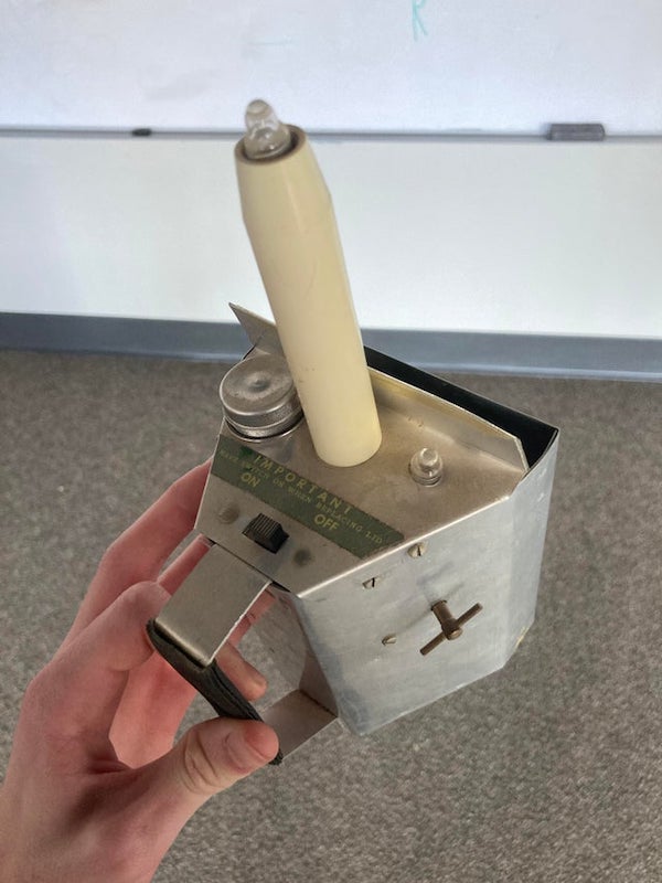 Found this deep in my church’s storage. Looks like there’s a place for a battery, multiple lights, and even a knob that only clicks when you twist it. It seems to be from the 70s and made primarily out of aluminum. All I can think of is it was some sort of tithe device, but it doesn’t seem to open.

A: A device found in a church that says “PLEASE” on it only has one meaning, MONEY. It some sort of offering collector. Sell it on eBay and donate the proceeds to a charity that helps abused altar boys recover.