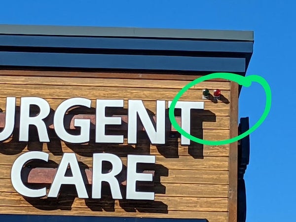 These red and green lights on the outside of this medical clinic

A: A lab I worked at had the same thing, but we used them to signal that we had FedEx packages for pickup.