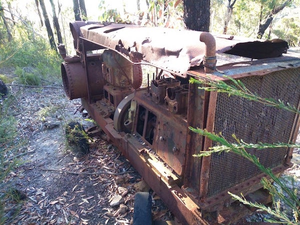 A rusty wheeled machine found on a fire trail near Sydney, Australia

A: It’s an air compressor.