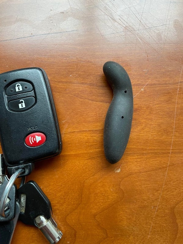 Found this hard plastic item in a kitchen drawer. Pictured next to a keychain for scale.

A: It’s a wine stopper. It’s made by Rabbit and has a pourer as part of a set. Amazon: Rabbit Wine Pourer with Stopper