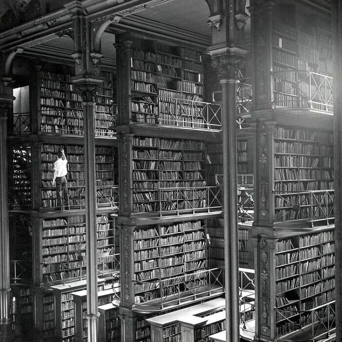 fascinating photos from history - A Man Browses For Books In The Old Public Library Of Cincinnati. The Building Was Demolished In 1955. Today An Office Building And A Parking Lot Stand Where It Used To Be